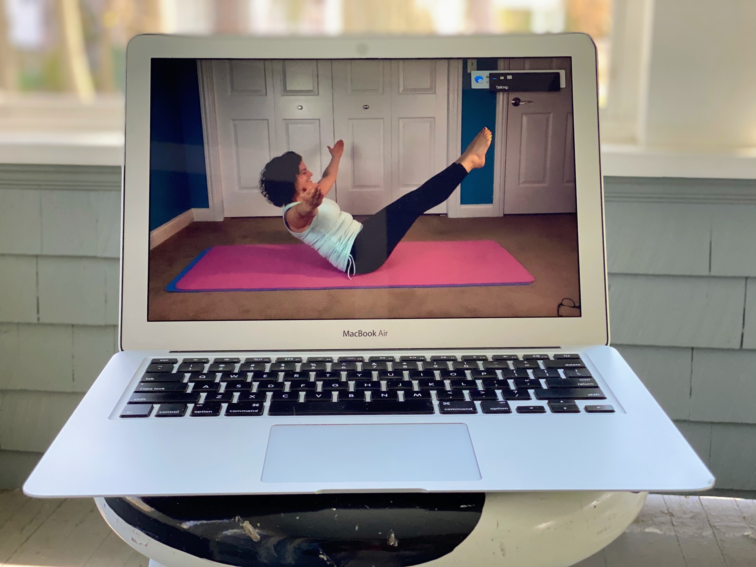 A MOVE livestream class trainer doing an inspiring Pilates teaser.
