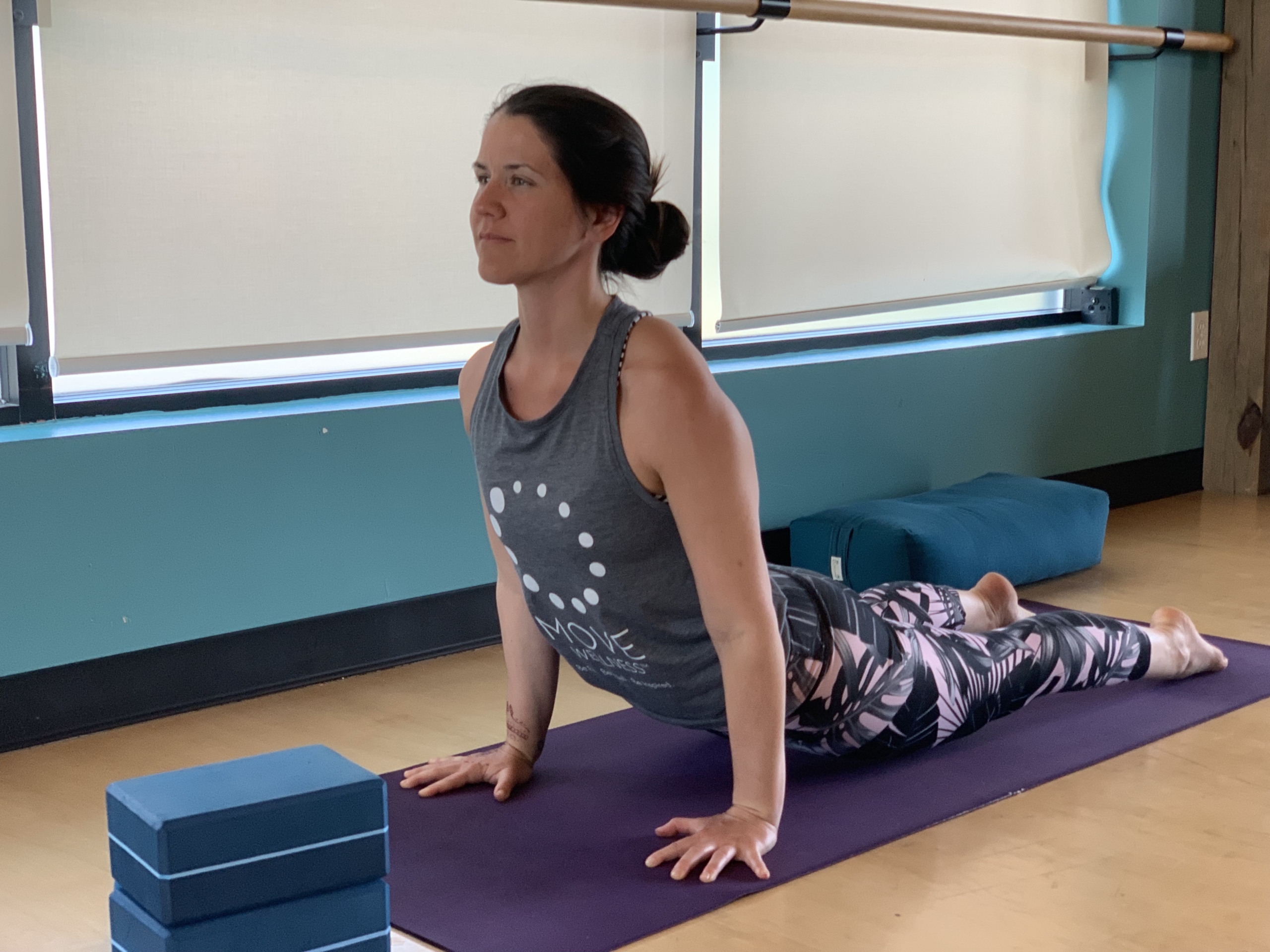 Yoga Teacher showing us how to be heart healthy by managing stress